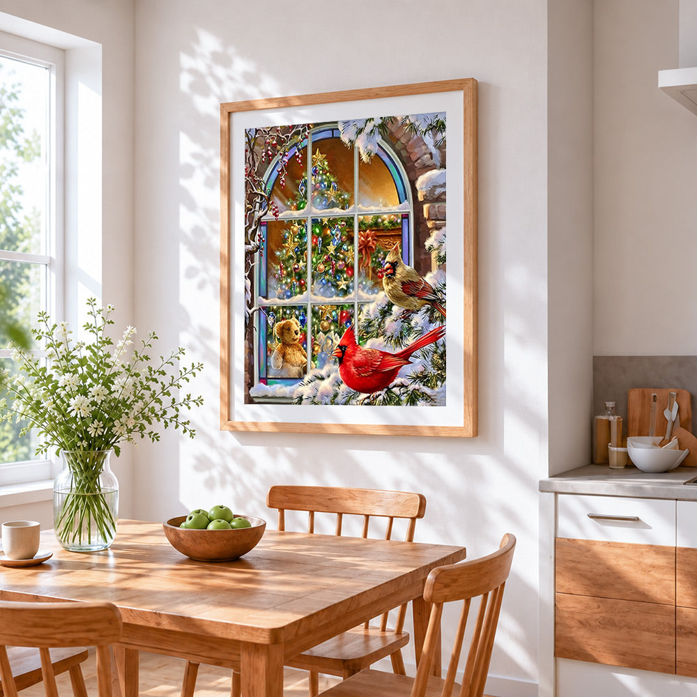 Christmas tree and red cardinals cross stitch artwork displayed on wall as home decor