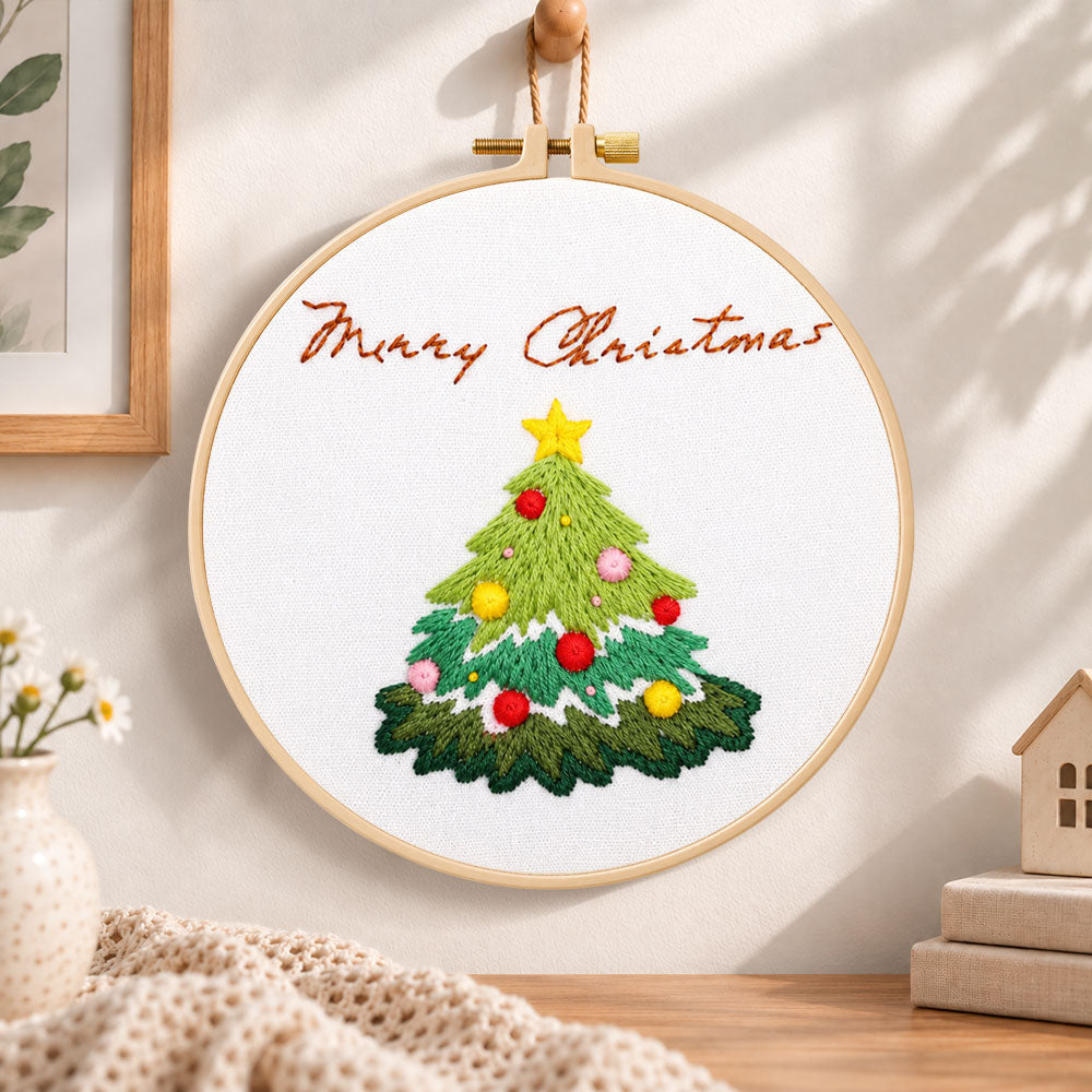 Christmas tree greeting embroidery hoop wall art displayed as warm and cosy handmade home decor