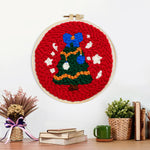 Finished christmas tree with snowflakes artwork displayed on a wall