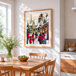 Christmas village street scene cross stitch artwork displayed on wall as home decor