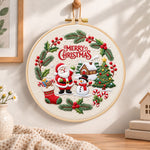 Christmas wreath scene embroidery hoop wall art displayed as warm and cosy handmade home decor