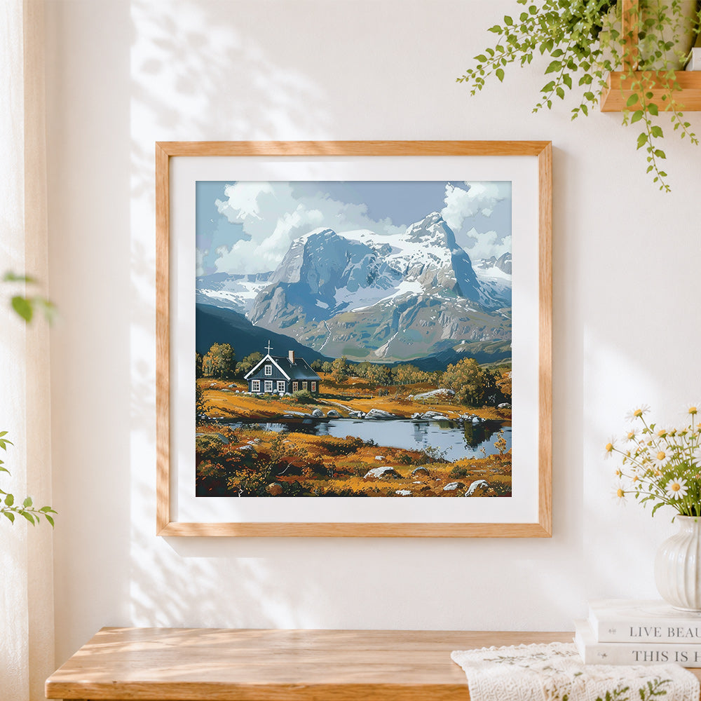 Finished church by a mountain lake cross stitch artwork displayed