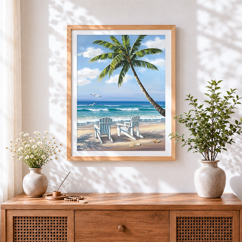 Finished classic beach chairs and palm tree cross stitch artwork displayed