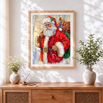 Finished classic father christmas carrying a sack of toys cross stitch artwork displayed