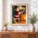 Finished classic father christmas filling stockings cross stitch artwork displayed