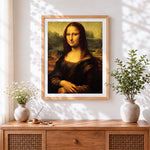 Finished classic mona lisa cross stitch artwork displayed