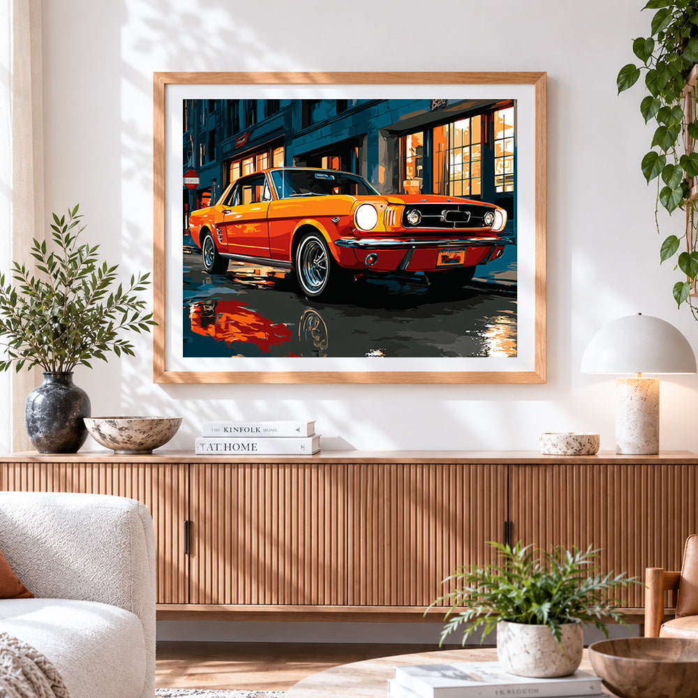 Finished classic orange car cross stitch artwork displayed