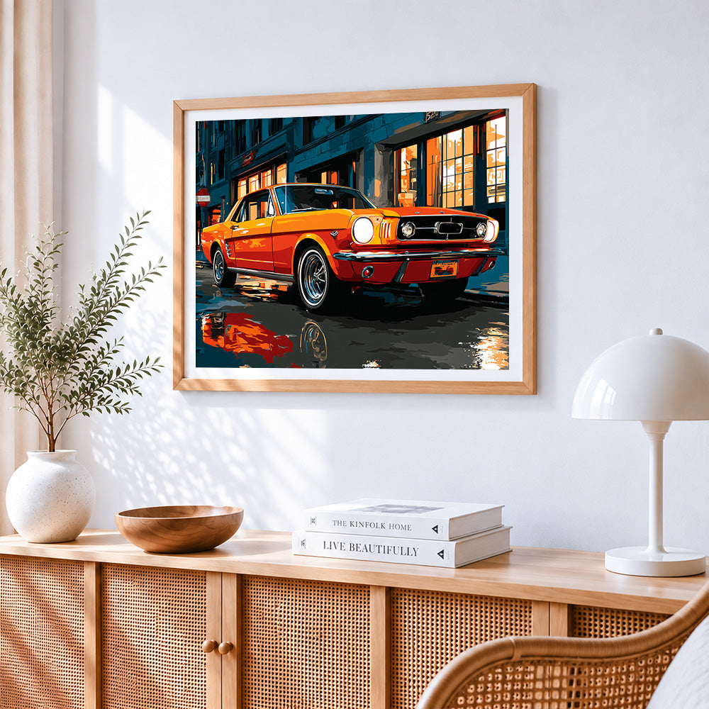 Classic orange car cross stitch artwork displayed on wall as home decor