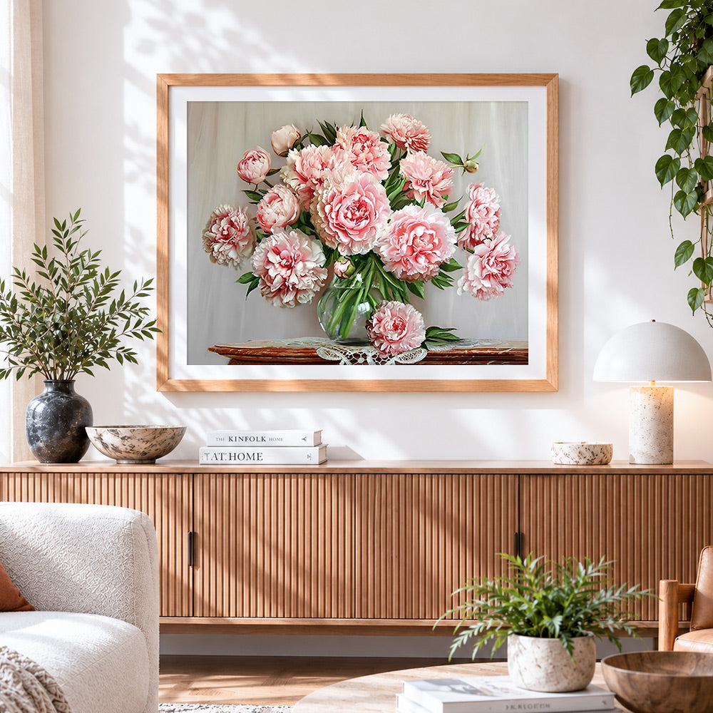 Finished classic pink peonies in a vase cross stitch artwork displayed