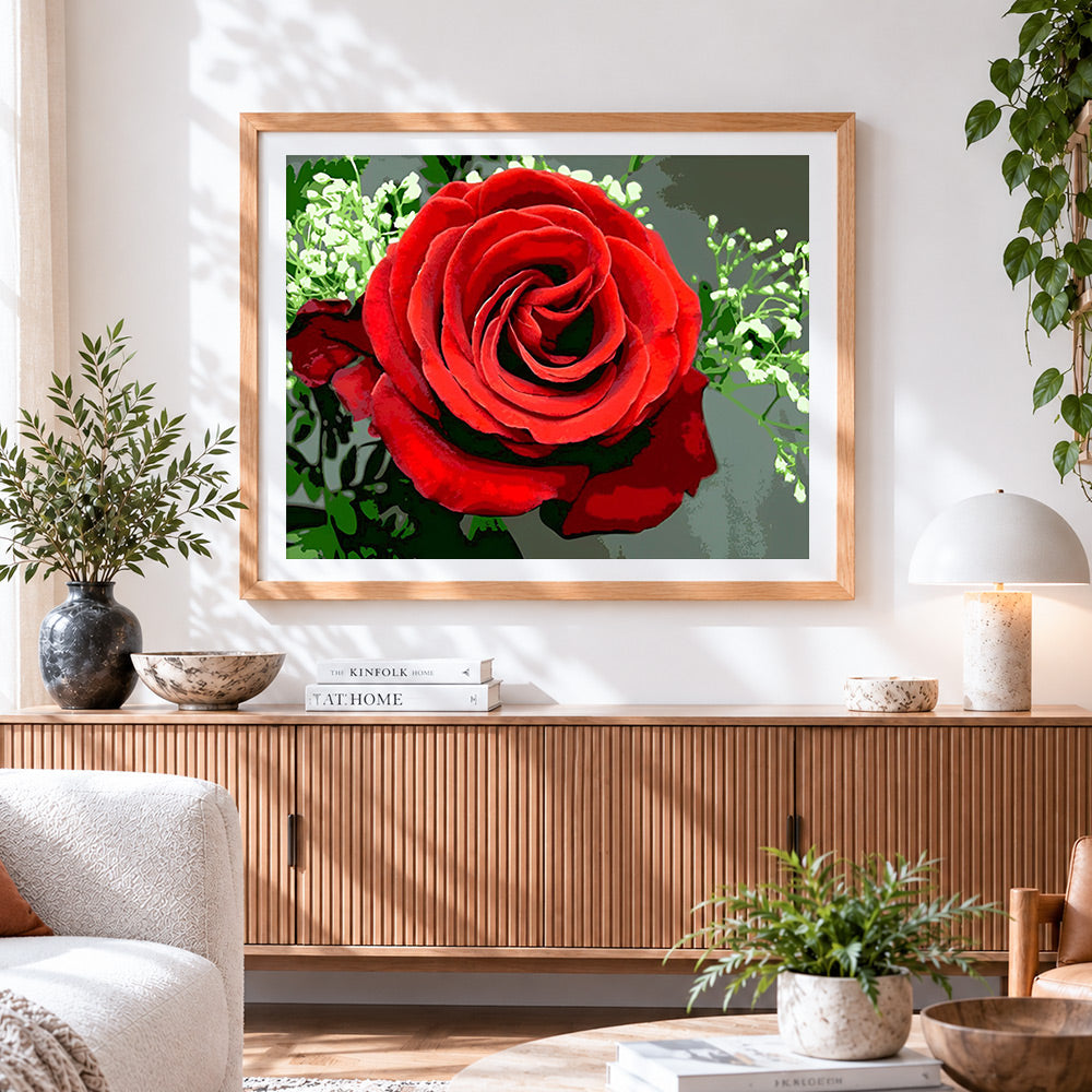 Finished classic red rose and gypsophila cross stitch artwork displayed