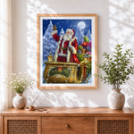 Finished classic santa sleigh and gifts cross stitch artwork displayed