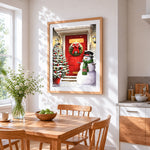 Classic snowman and red door cross stitch artwork displayed on wall as home decor