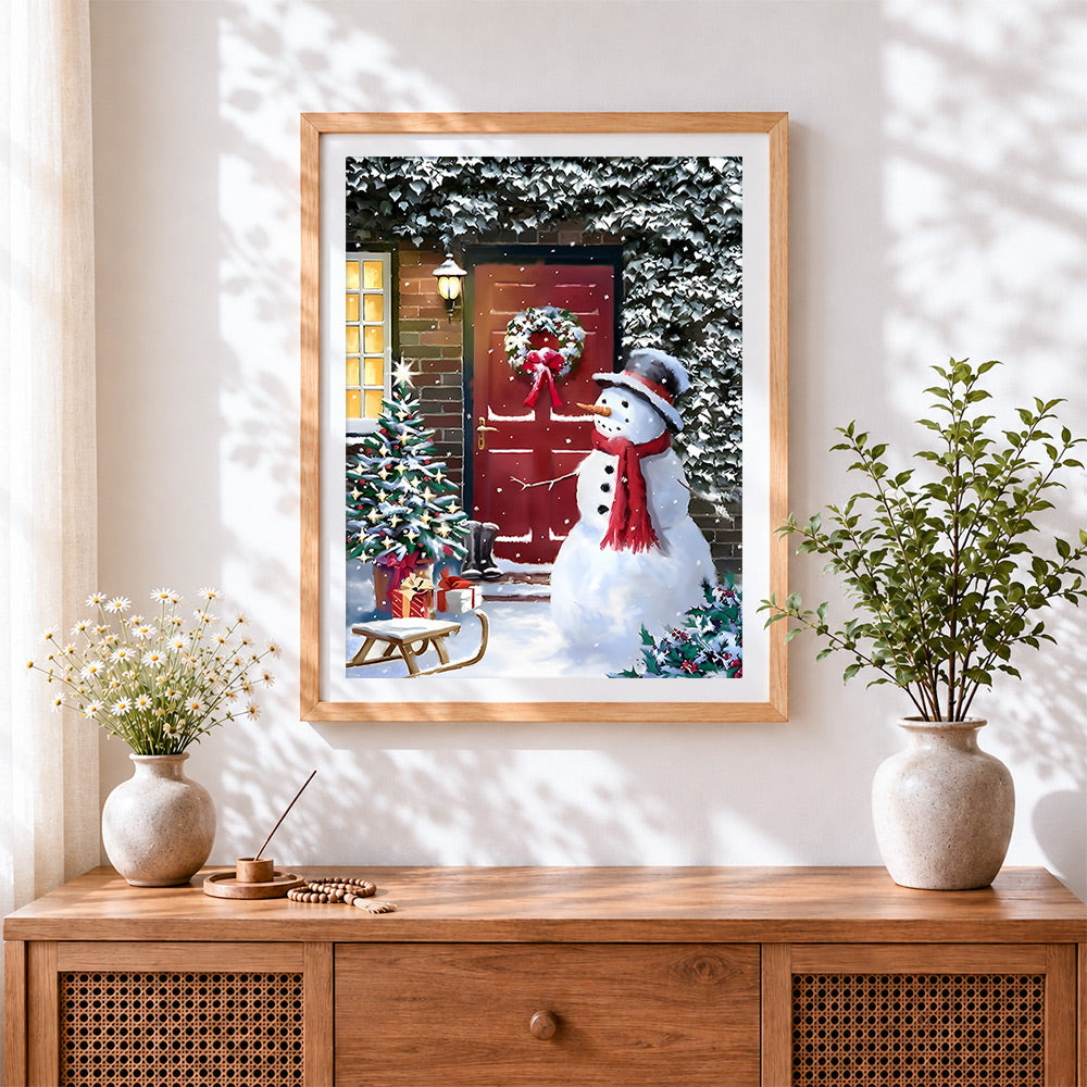 Finished classic snowman by a red door cross stitch artwork displayed