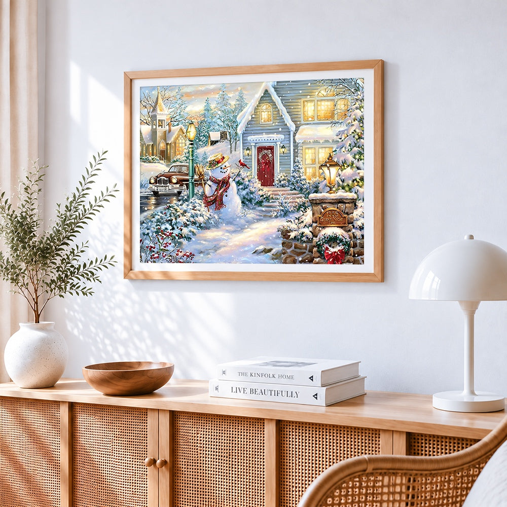 Classic snowman outside the house cross stitch artwork displayed on wall as home decor