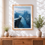 Finished cliff edge over fjord cross stitch artwork displayed