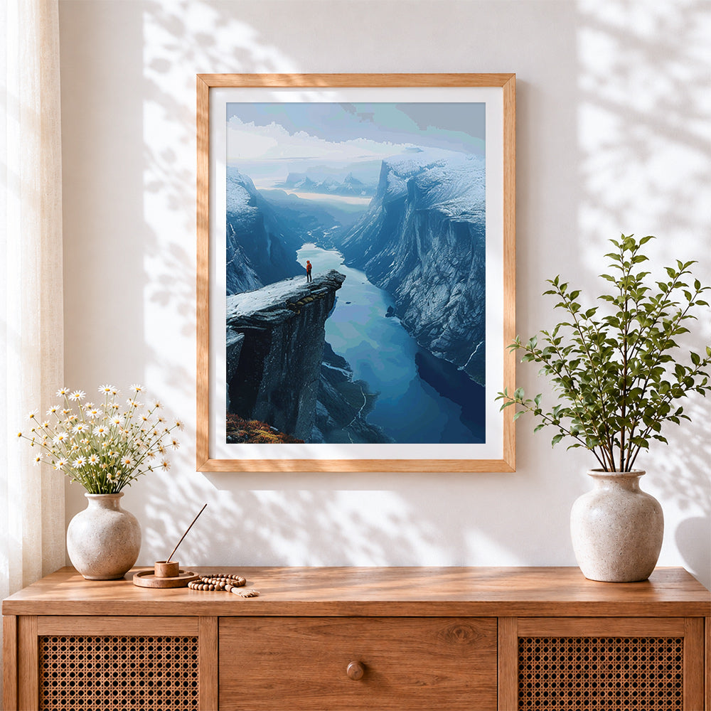 Finished cliff edge over fjord cross stitch artwork displayed