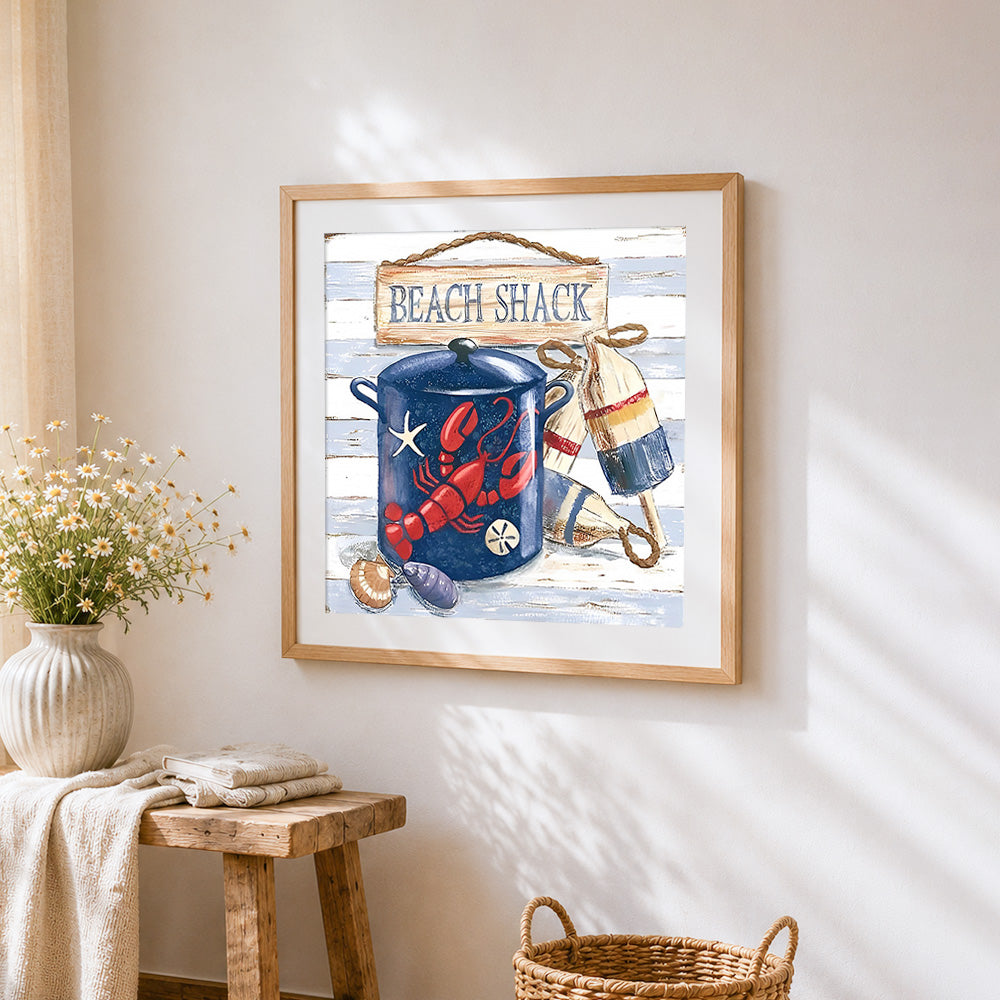 Coastal beach shack still life cross stitch artwork displayed on wall as home decor