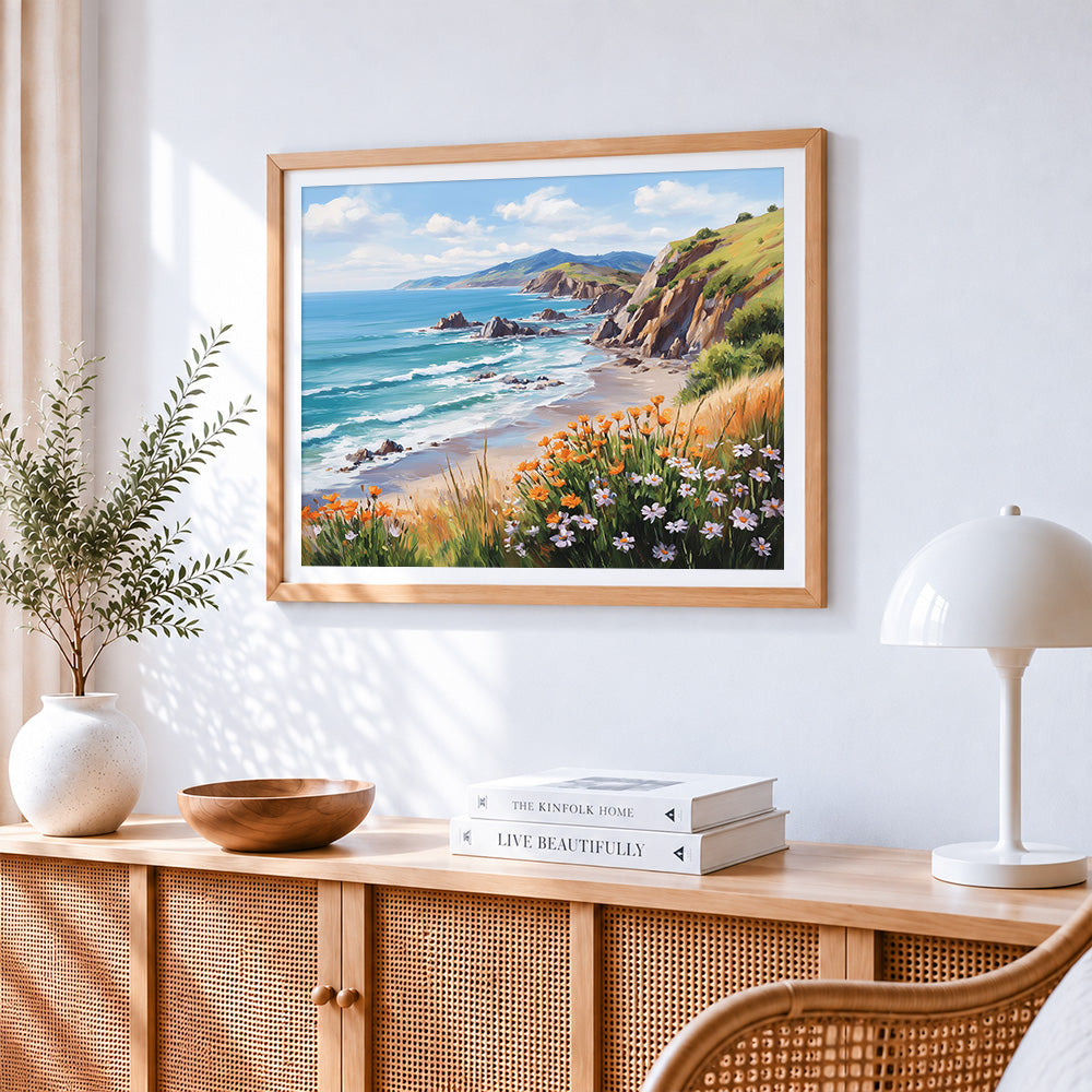Coastal cliffs and wildflowers cross stitch artwork displayed on wall as home decor