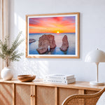 Coastal rock arch at sunset cross stitch artwork displayed on wall as home decor