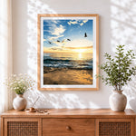 Finished coastal seascape at sunset cross stitch artwork displayed