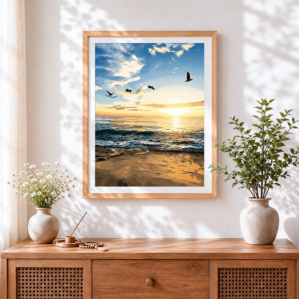 Finished coastal seascape at sunset cross stitch artwork displayed