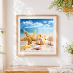 Finished coastal starfish and seashells on the beach cross stitch artwork displayed