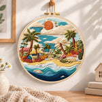 Coastal sunset cove embroidery hoop wall art displayed as warm and cosy handmade home decor