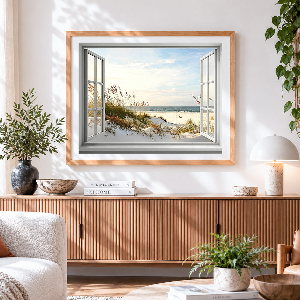 Finished coastal view through open window cross stitch artwork displayed