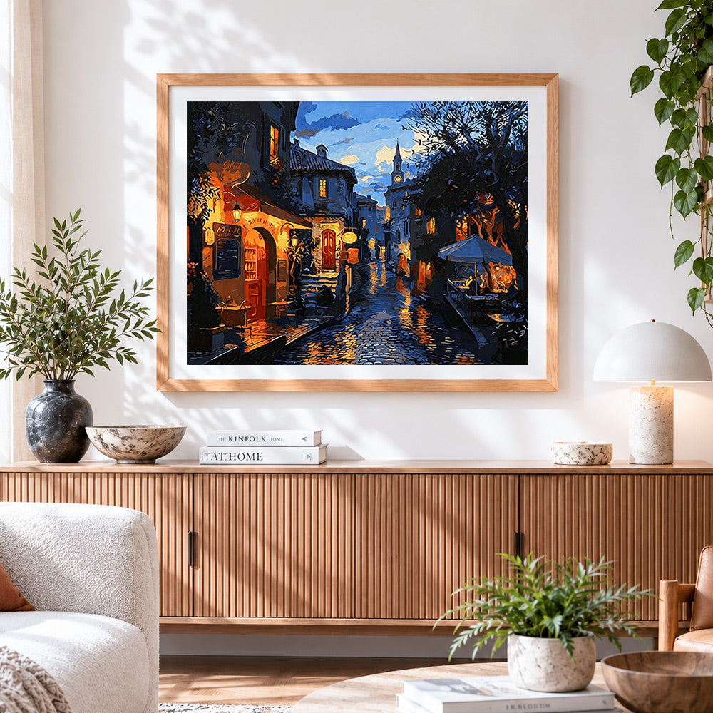 Finished cobblestone street at night cross stitch artwork displayed