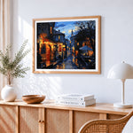 Cobblestone street at night cross stitch artwork displayed on wall as home decor