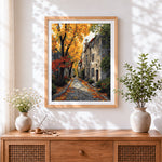 Finished cobblestone street in autumn cross stitch artwork displayed