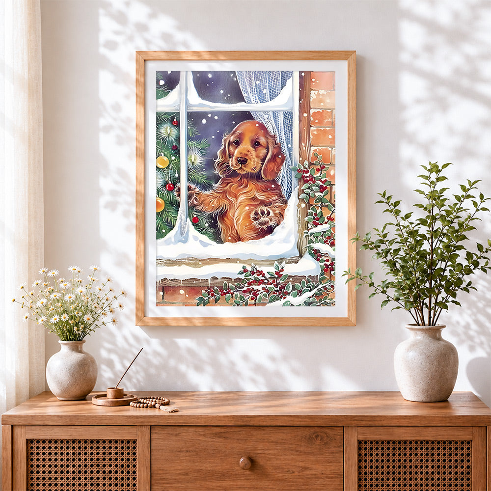 Finished cocker spaniel puppy looking out a snowy window cross stitch artwork displayed