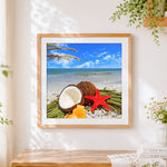 Finished coconuts and starfish on a tropical beach cross stitch artwork displayed