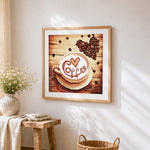 Coffee cup and beans cross stitch artwork displayed on wall as home decor