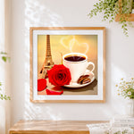 Finished coffee red rose and eiffel tower cross stitch artwork displayed