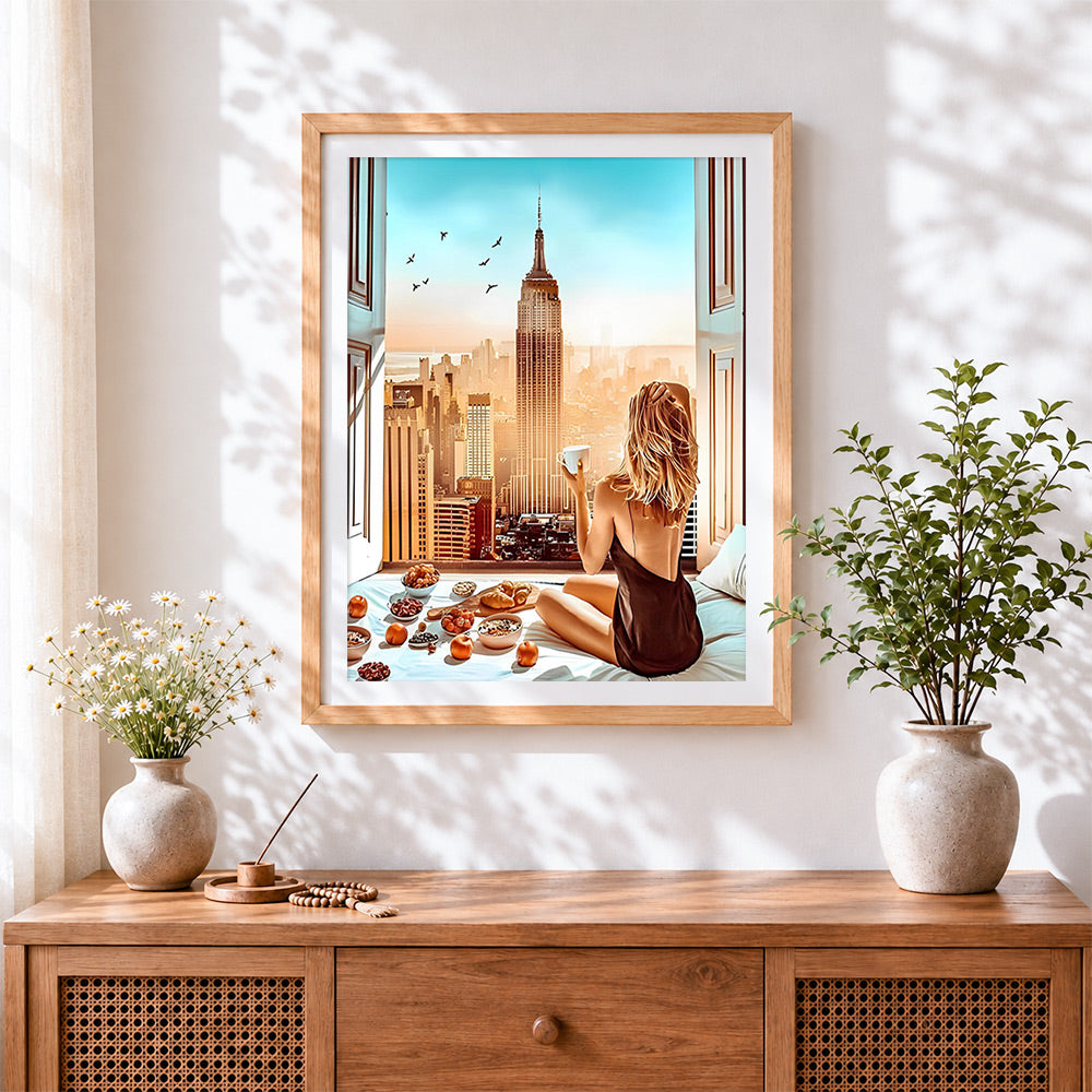 Finished coffee with a view of the empire state building cross stitch artwork displayed