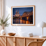 Cologne cathedral and bridge at night cross stitch artwork displayed on wall as home decor