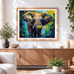 Finished colourful abstract elephant eating bananas cross stitch artwork displayed