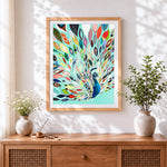 Finished colourful abstract peacock cross stitch artwork displayed