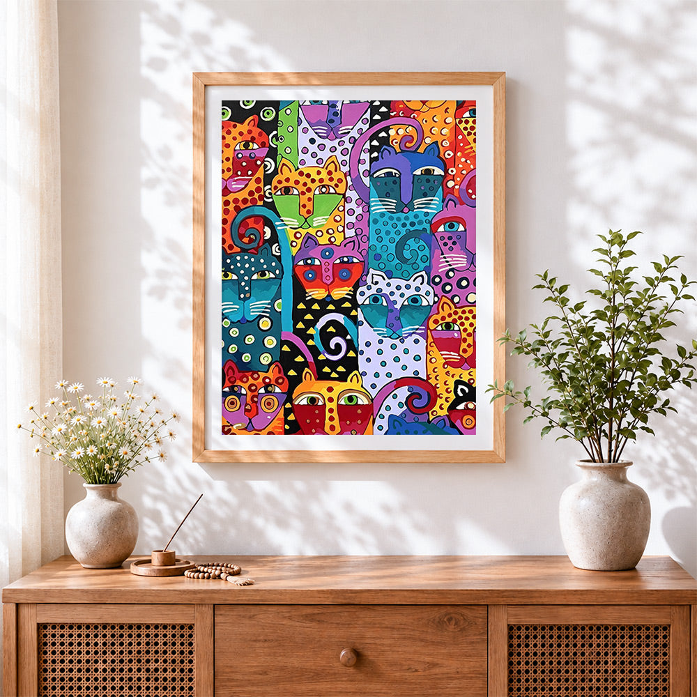 Finished colourful abstract pop art cats cross stitch artwork displayed