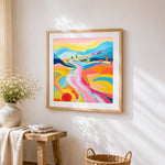 Colourful abstract rolling hills cross stitch artwork displayed on wall as home decor