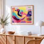 Colourful abstract shapes cross stitch artwork displayed on wall as home decor