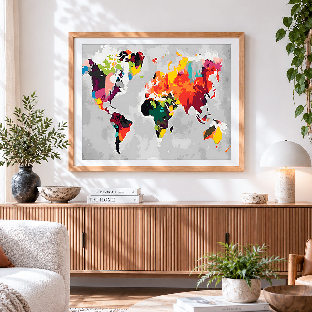 Finished colourful abstract world map cross stitch artwork displayed