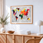 Colourful abstract world map cross stitch artwork displayed on wall as home decor