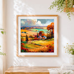 Finished colourful autumn fields cross stitch artwork displayed
