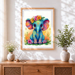 Finished colourful baby elephant with floral crown cross stitch artwork displayed