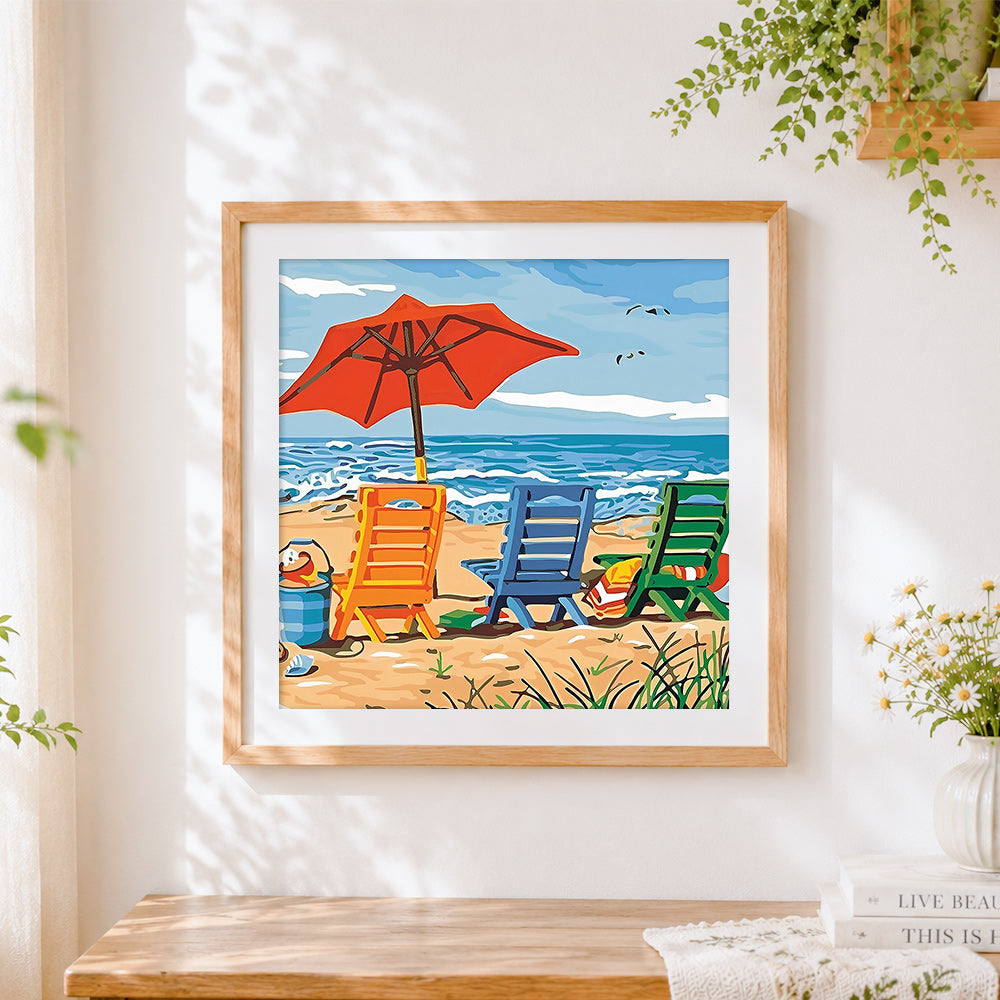 Finished colourful beach chairs and red umbrella paint by numbers artwork displayed as home decor