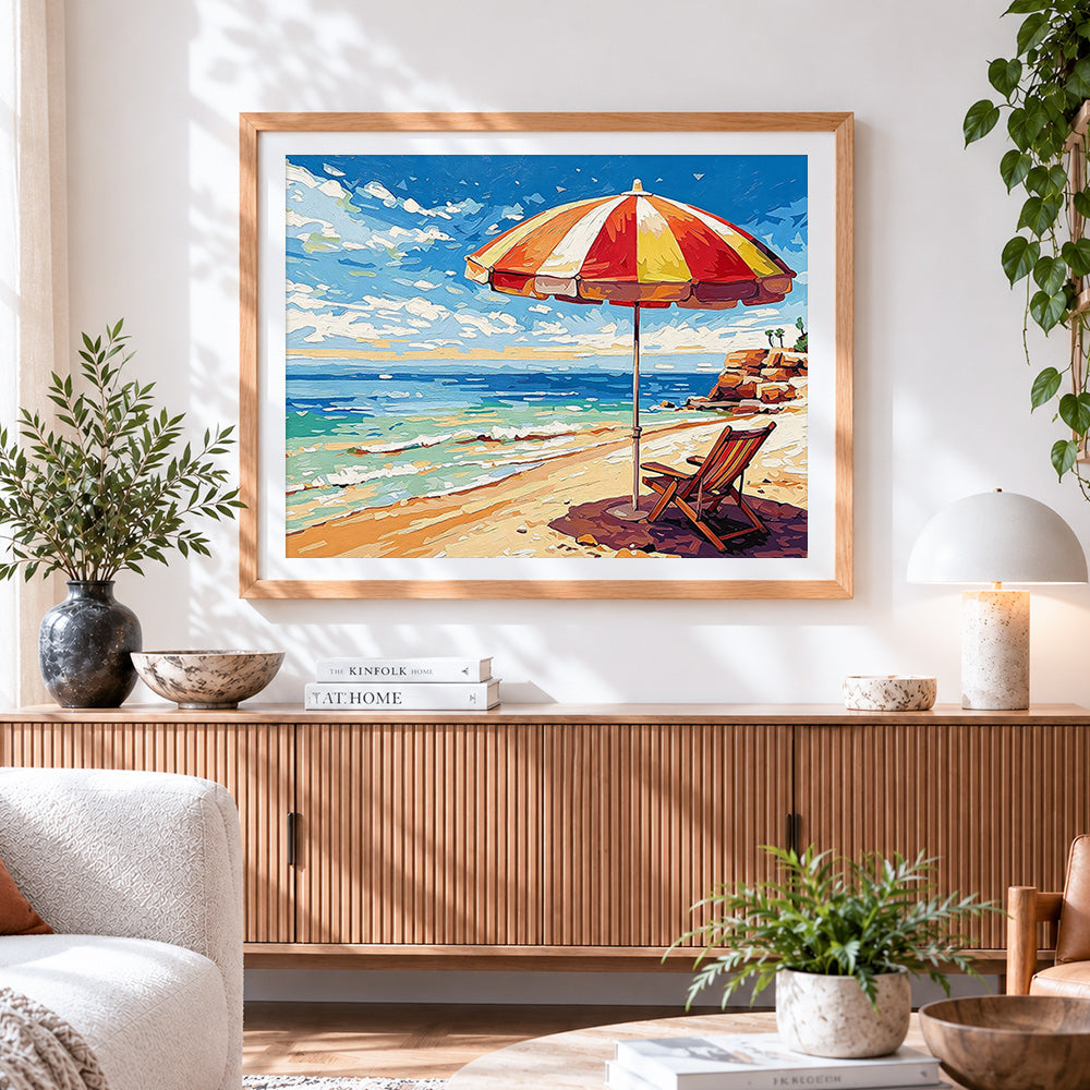Finished colourful beach parasol and lounger cross stitch artwork displayed