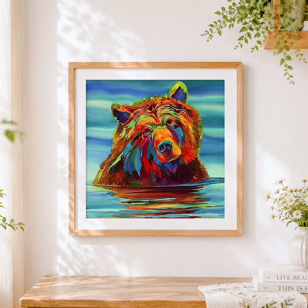 Finished colourful bear in water cross stitch artwork displayed