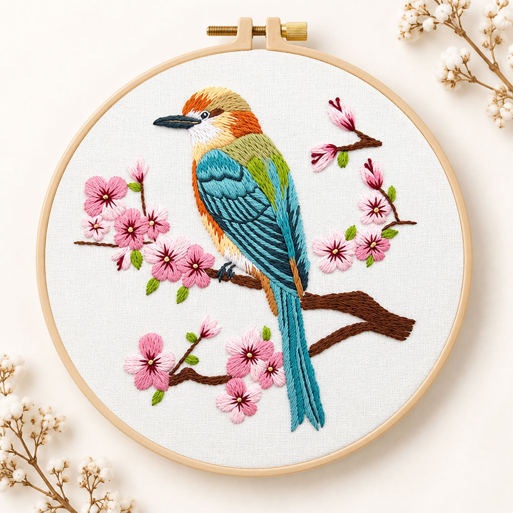 Colourful bird amid pink cherry blossoms embroidery kit